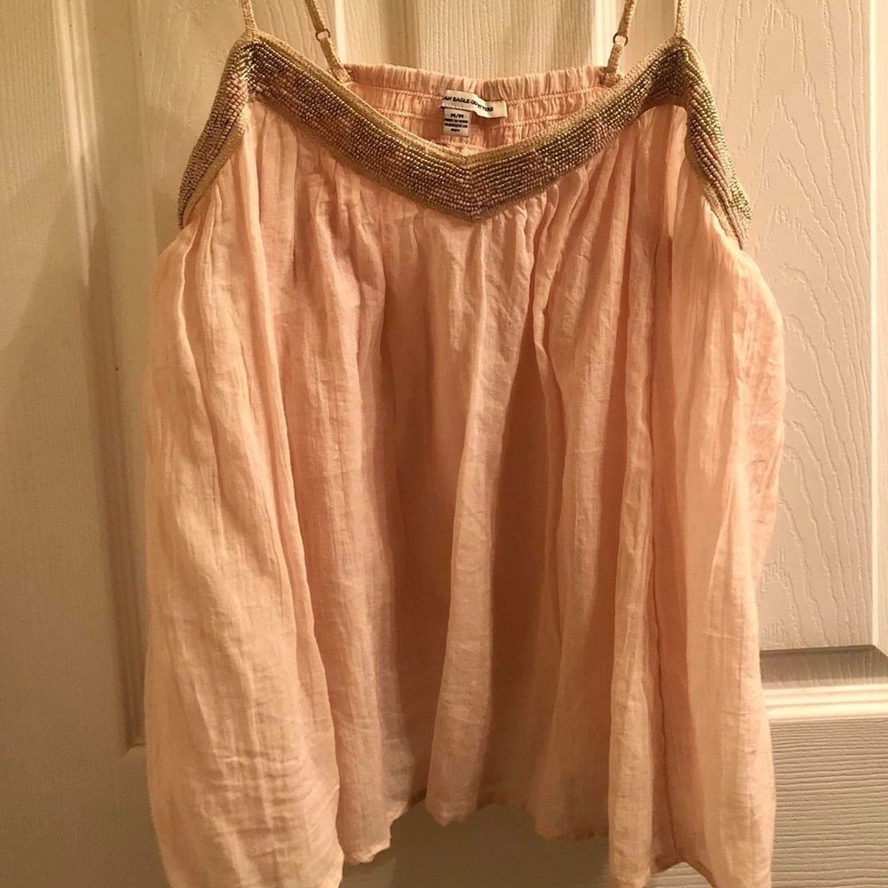 baby pink american eagle tank with gold accents.